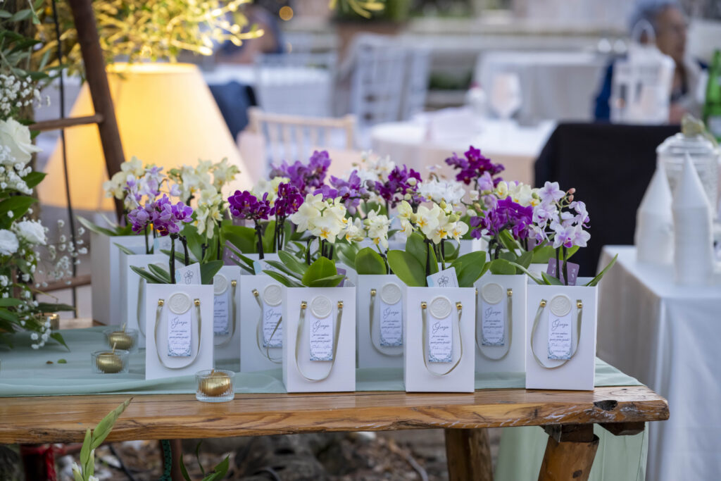Curated wedding details with orchids, botanical elements and intentional styling reflecting a bespoke destination wedding design in Italy.