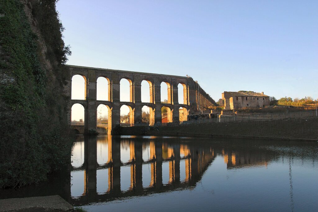 Historic aqueduct in Tuscia, Italy, envisioned as a destination wedding setting combining architecture, landscape and design.